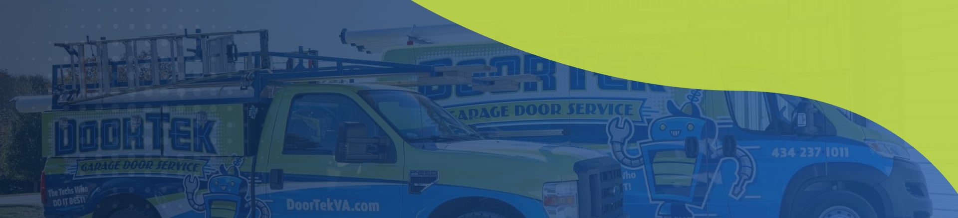 A clean, organized garage interior with a closed sectional garage door, storage cabinets, shelving, and tools arranged along both sides.
