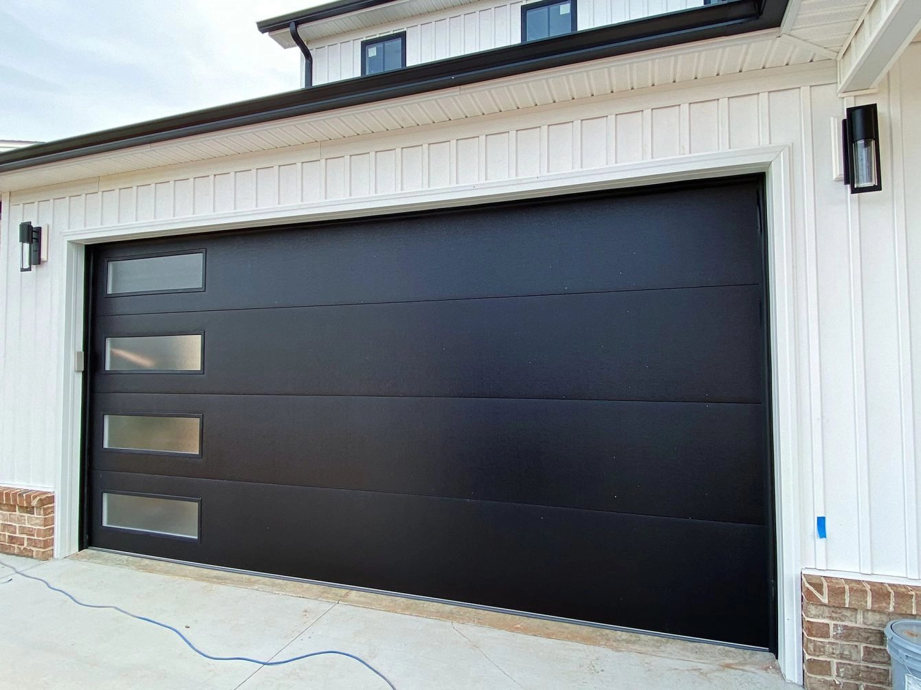 Black Garage Door with Windows Down the Side 